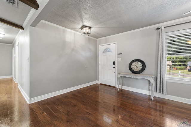 entryway with hardwood / wood-style flooring, a textured ceiling, and visible vents