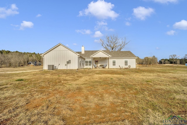 17255 Stella Maris St, Winona, TX 75792 - view of front facade with central AC unit, a chimney, and a front yard