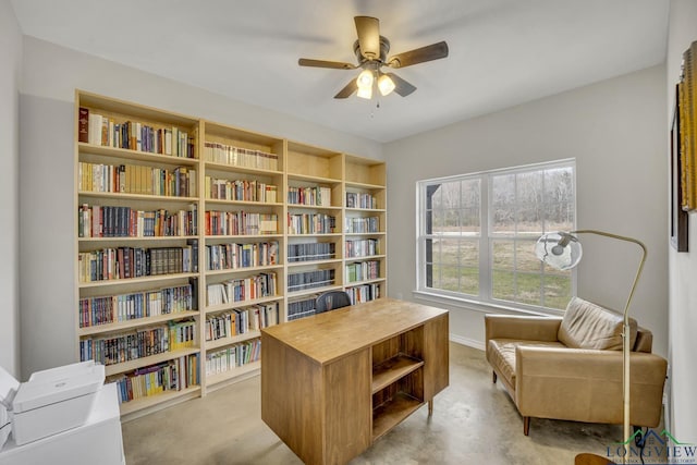 17255 Stella Maris St, Winona, TX 75792 - living area featuring finished concrete floors, baseboards, and a ceiling fan