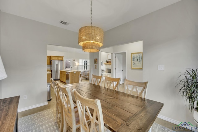 17255 Stella Maris St, Winona, TX 75792 - dining room with visible vents, baseboards, and a notable chandelier