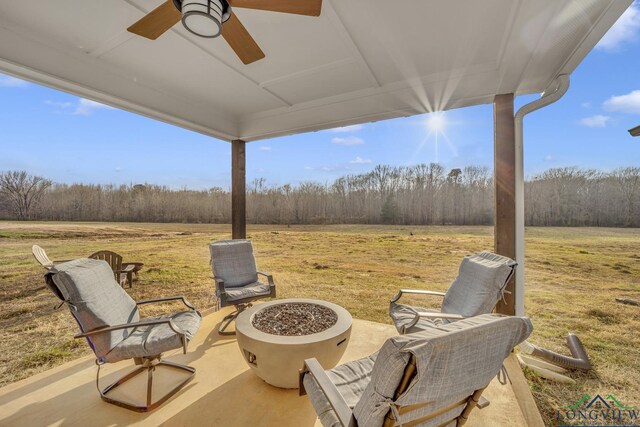 17255 Stella Maris St, Winona, TX 75792 - view of patio featuring a view of trees, a fire pit, and ceiling fan