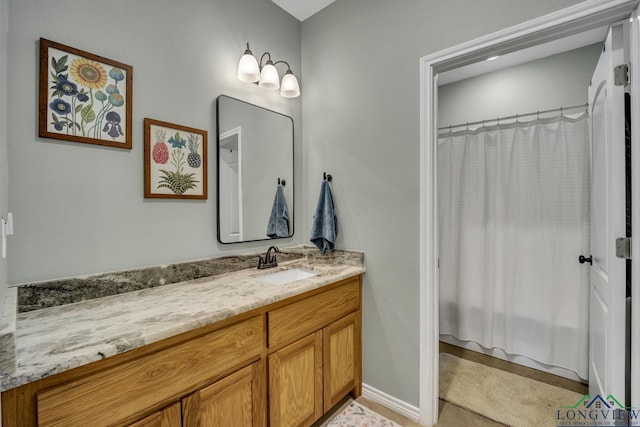 17255 Stella Maris St, Winona, TX 75792 - full bath with a shower with shower curtain, baseboards, and vanity