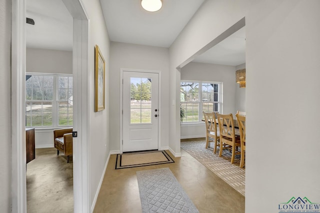 17255 Stella Maris St, Winona, TX 75792 - entryway featuring a healthy amount of sunlight, concrete floors, and baseboards