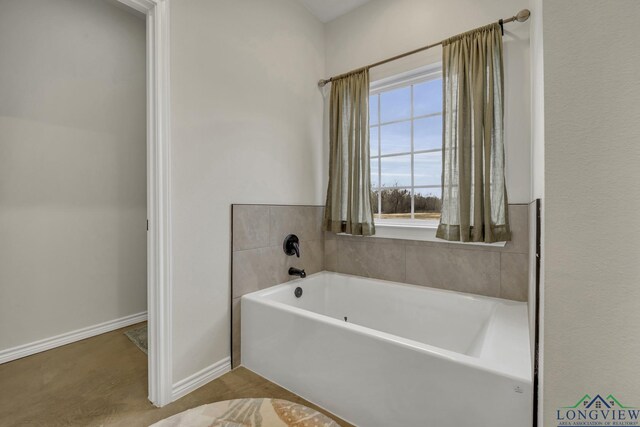 17255 Stella Maris St, Winona, TX 75792 - bathroom featuring baseboards and a garden tub