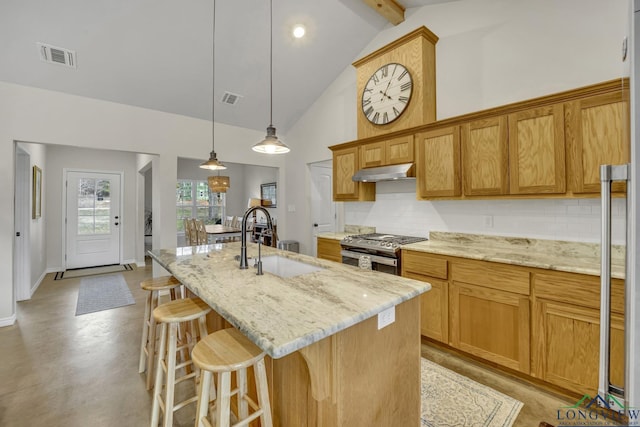 17255 Stella Maris St, Winona, TX 75792 - kitchen with visible vents, under cabinet range hood, gas range, high vaulted ceiling, and a sink