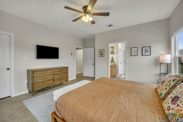 17255 Stella Maris St, Winona, TX 75792 - bedroom featuring baseboards, visible vents, concrete floors, ceiling fan, and ensuite bathroom