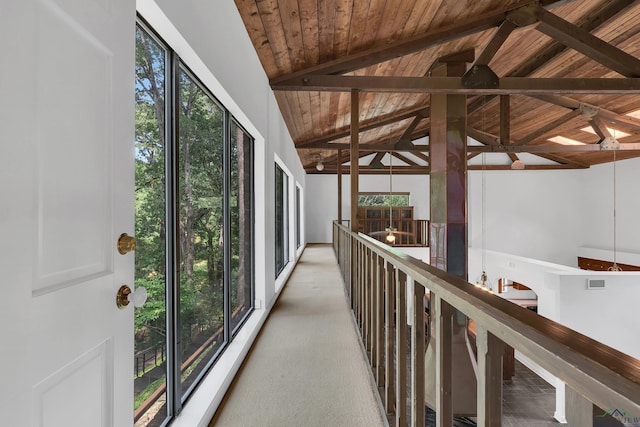 interior space with lofted ceiling with beams and wooden ceiling