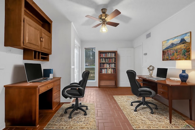 home office featuring ceiling fan and ornamental molding