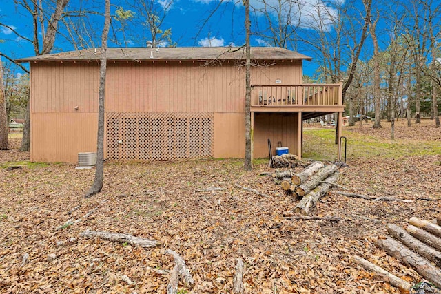 exterior space with a garage and a wooden deck