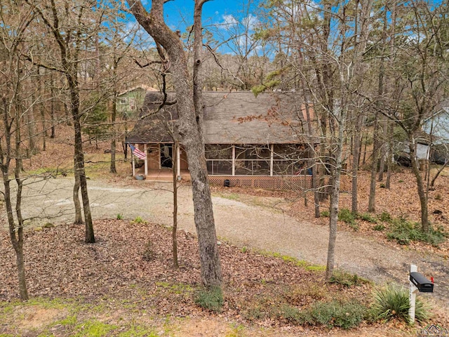 view of front of house featuring a sunroom