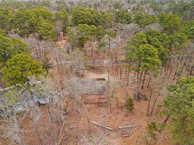 drone / aerial view featuring a forest view