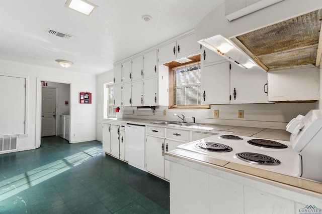 kitchen featuring ventilation hood, white dishwasher, sink, white cabinetry, and washer / clothes dryer