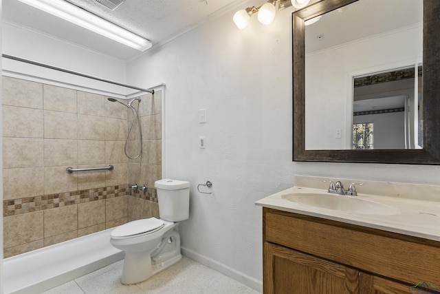 bathroom with crown molding, vanity, a textured ceiling, and tiled shower