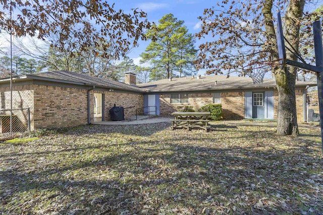 back of house with a patio