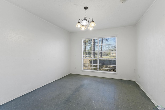 unfurnished room featuring a notable chandelier