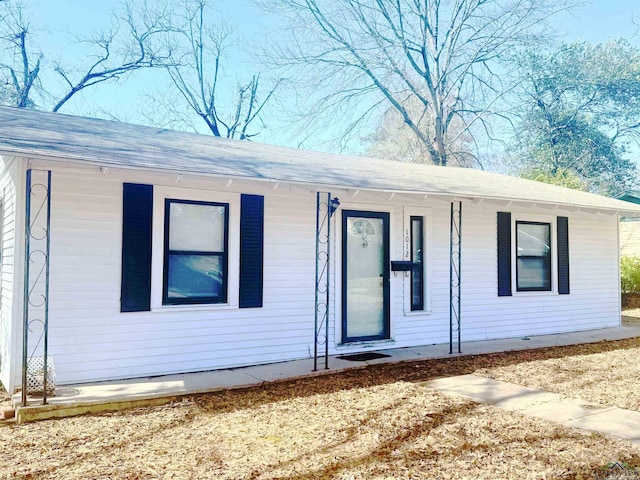 view of front of home with roof with shingles and covered porch