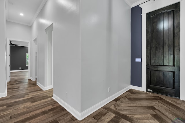 entrance foyer featuring baseboards and crown molding