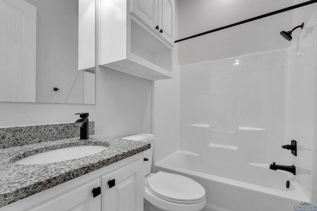 full bath featuring toilet, vanity, and bathtub / shower combination