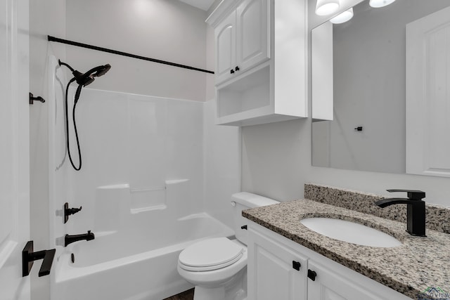 full bath with vanity, washtub / shower combination, and toilet