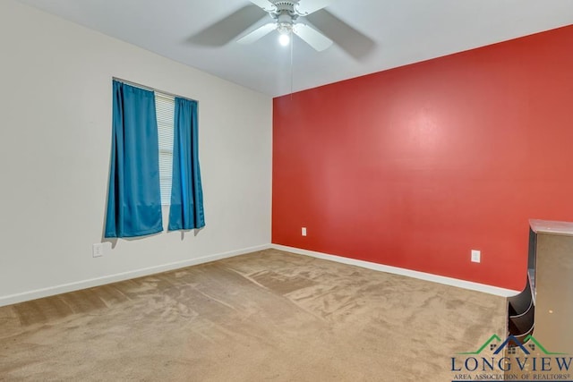 empty room with carpet floors and ceiling fan