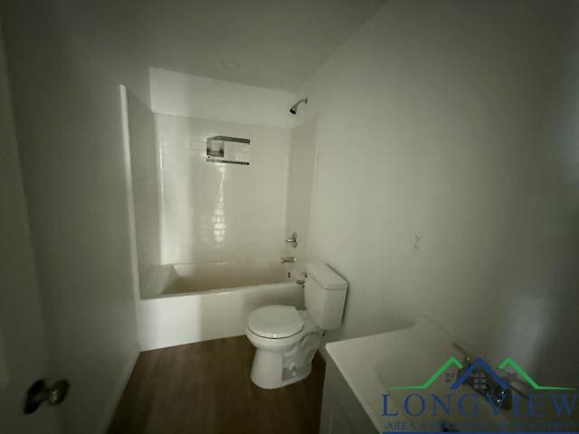 full bathroom featuring  shower combination, vanity, wood finished floors, and toilet