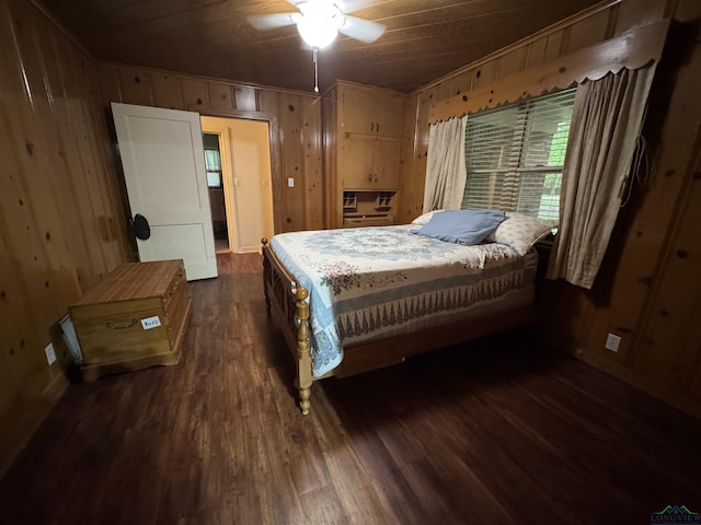 1641 Handy Rd, Diana, TX 75640 - bedroom featuring wooden walls and dark wood-style floors