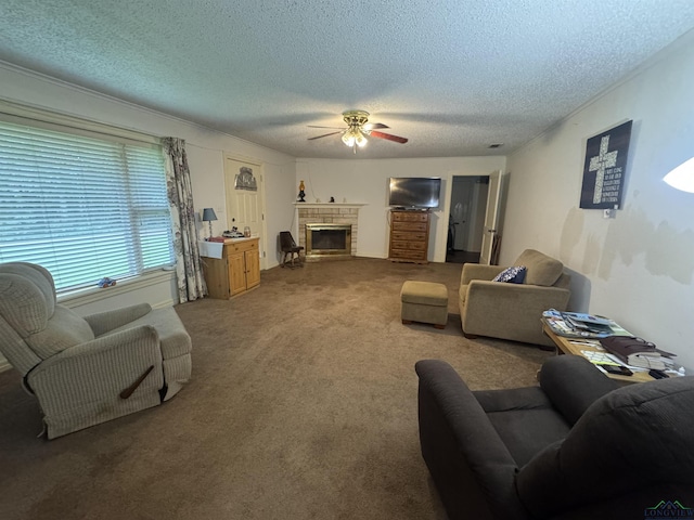 1641 Handy Rd, Diana, TX 75640 - carpeted living area featuring a ceiling fan, a textured ceiling, and a brick fireplace