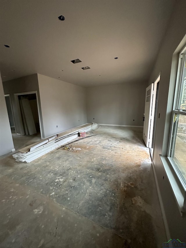 unfurnished living room featuring plenty of natural light