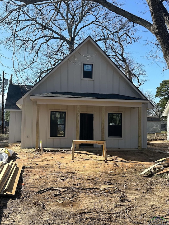 rear view of house with a porch