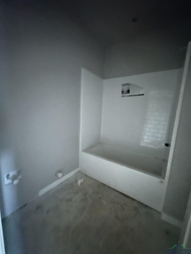 bathroom featuring a tub to relax in