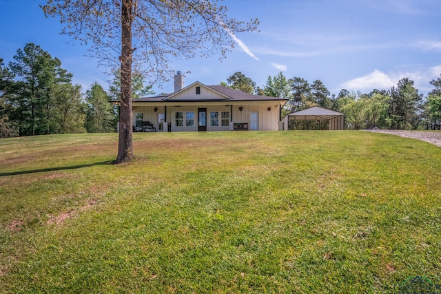 view of front facade featuring a porch, a front yard, and a carport