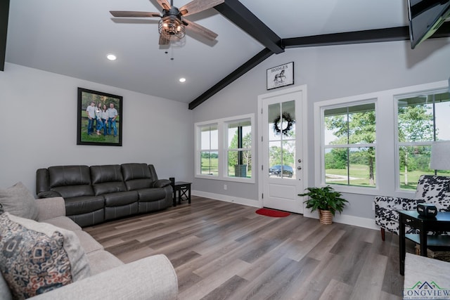 living room with vaulted ceiling with beams, ceiling fan, and wood-type flooring