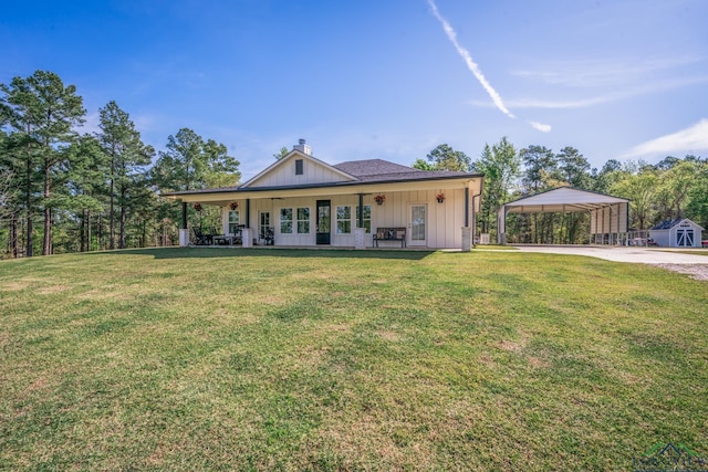 view of front facade with a carport, covered porch, and a front lawn