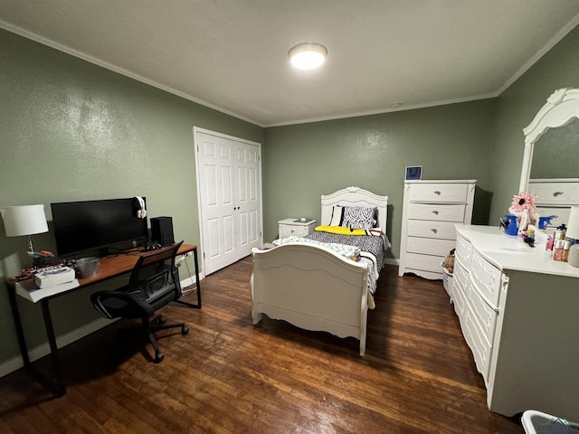 bedroom featuring crown molding and dark wood-type flooring