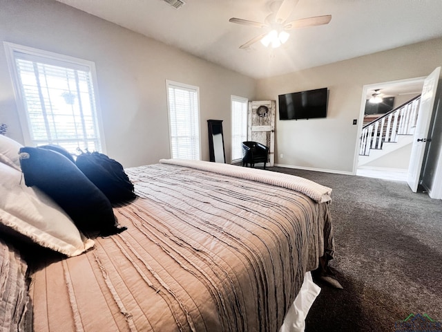 bedroom with ceiling fan, carpet flooring, visible vents, and baseboards