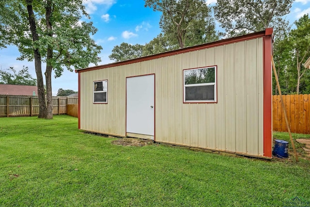 view of outbuilding with an outbuilding and a fenced backyard