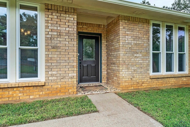 entrance to property with brick siding