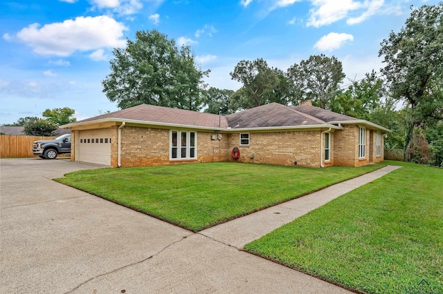 ranch-style house featuring brick siding, a front yard, fence, and a garage