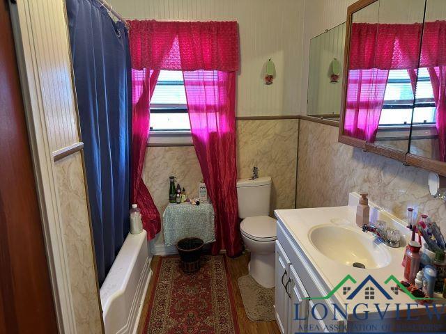 729 Rosehill Rd, Timpson, TX 75975 - bathroom with vanity and wallpapered walls