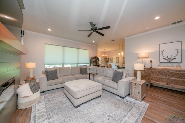 4523 Lone Oak Ln, Longview, TX 75605 - living area featuring a ceiling fan, ornamental molding, a chandelier, wood finished floors, and recessed lighting