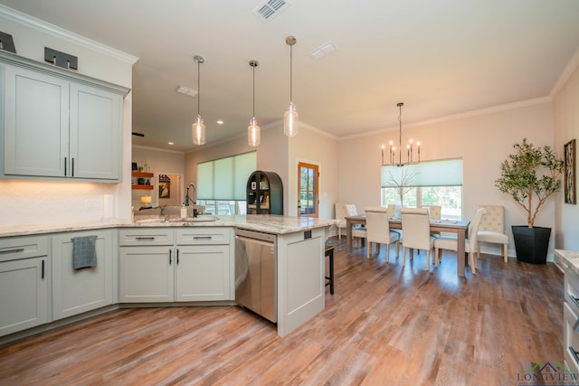 4523 Lone Oak Ln, Longview, TX 75605 - kitchen featuring stainless steel dishwasher, light wood finished floors, a peninsula, a chandelier, and ornamental molding
