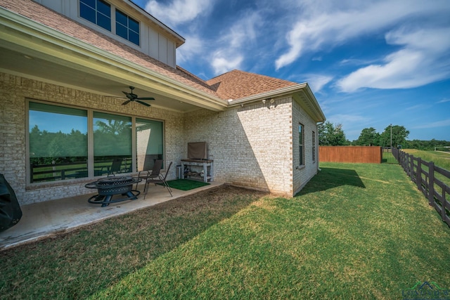 4523 Lone Oak Ln, Longview, TX 75605 - back of house featuring a ceiling fan, a patio, a fenced backyard, brick siding, and a shingled roof