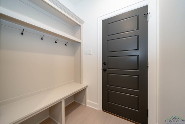 mudroom with baseboards and light wood finished floors