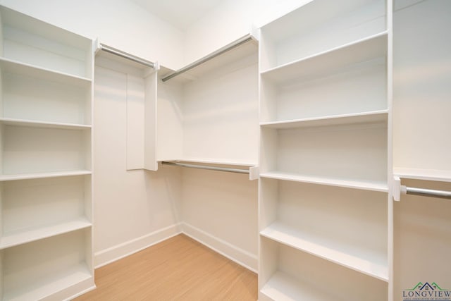 spacious closet featuring wood finished floors