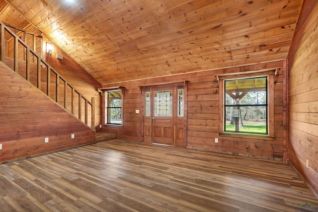 interior space with vaulted ceiling, wood ceiling, wooden walls, and hardwood / wood-style floors