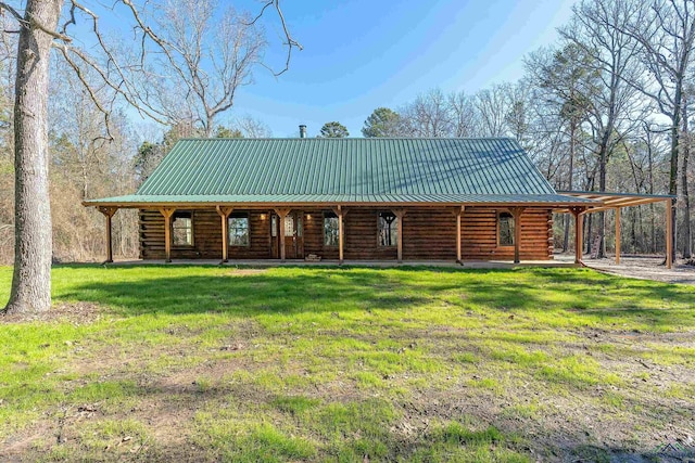 rear view of house with a lawn