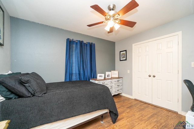 342 W Doctors Rd, Longview, TX 75602 - bedroom with wood finished floors, ceiling fan, and baseboards