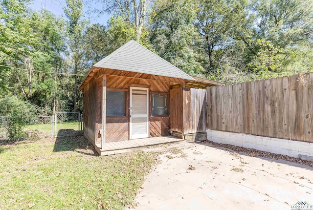 view of outbuilding with a lawn