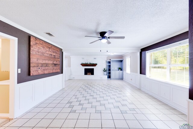 unfurnished living room featuring light tile patterned floors, a textured ceiling, and ceiling fan