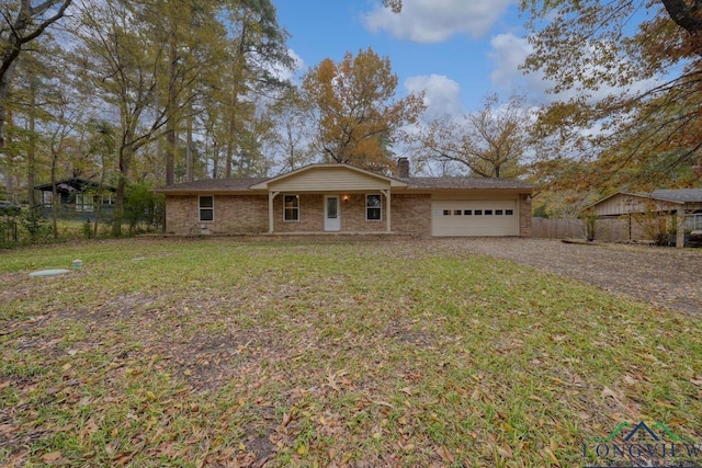 ranch-style home with a garage and a front yard